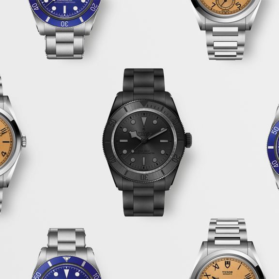 Tudor Armbanduhren Kollektion mit verschiedenen Modellen &ndash; darunter Taucheruhren und klassische Designs in Edelstahl, Schwarz und Blau, hochwertig inszeniert auf hellem Hintergrund