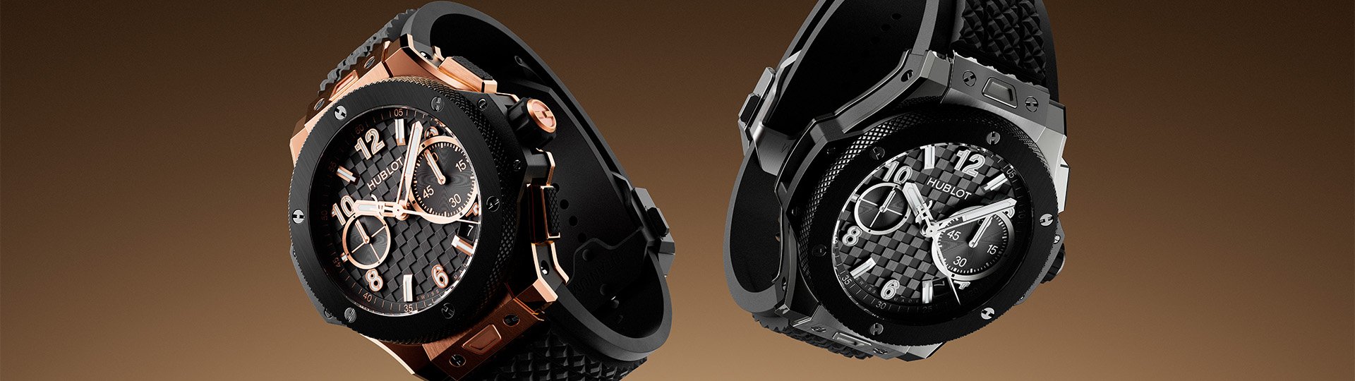 Hublot Big Bang Chronograph in Schwarz mit Kautschukarmband, gezeigt in mehreren Varianten aus Titan, Keramik und Ros&eacute;gold vor warmem braunem Hintergrund