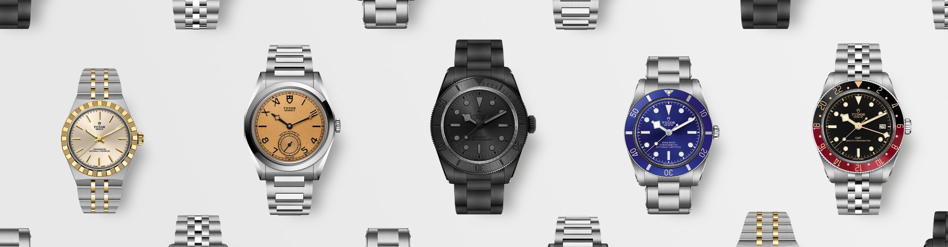 Tudor Armbanduhren Kollektion mit verschiedenen Modellen &ndash; darunter Taucheruhren und klassische Designs in Edelstahl, Schwarz und Blau, hochwertig inszeniert auf hellem Hintergrund