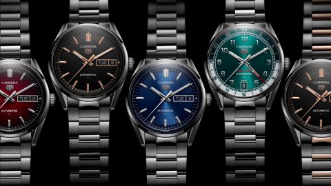 Mehrere TAG Heuer Day-Date Uhren nebeneinander liegend vor schwarzem Hintergrund