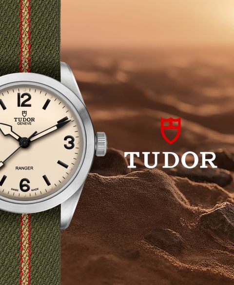 Teilansicht der TUDOR Ranger mit Zifferblatt in „Dust“ vor sandiger Felslandschaft, ergänzt durch TUDOR Logo. Teilansicht der TUDOR Ranger mit Zifferblatt in „Dust“ vor sandiger Felslandschaft, ergänzt durch TUDOR Logo.
