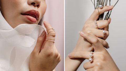 Zwei weibliche Hände mit mehreren Yana Nesper Ringen aus Gold, besetzt mit weißen Perlen in verschiedenen Größen, vor hellem Hintergrund. Zwei weibliche Hände mit mehreren Yana Nesper Ringen aus Gold, besetzt mit weißen Perlen in verschiedenen Größen, vor hellem Hintergrund.