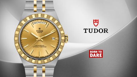 Tudor Royal Uhr in Bicolor Edelstahl und Gold mit goldenem Zifferblatt, Day-Date Anzeige und „Born to Dare“ Schriftzug, elegante Produktdarstellung auf hellem Hintergrund Tudor Royal Uhr in Bicolor Edelstahl und Gold mit goldenem Zifferblatt, Day-Date Anzeige und „Born to Dare“ Schriftzug, elegante Produktdarstellung auf hellem Hintergrund